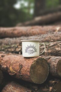 cup of coffee by logs